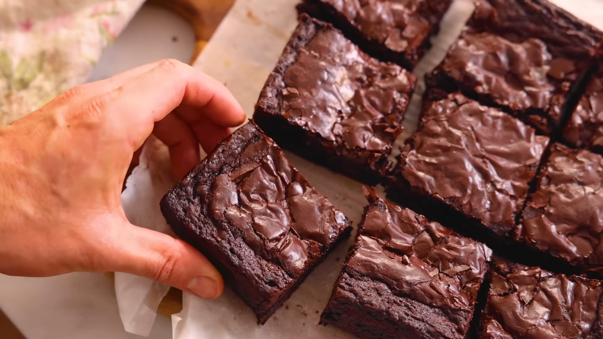 Hand picking up a cut brownie